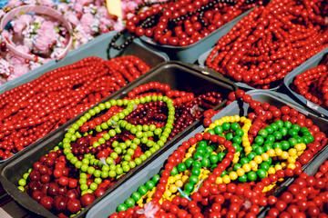 Red beads made of wood. Close-up. Brightly.