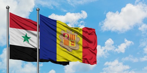 Syria and Andorra flag waving in the wind against white cloudy blue sky together. Diplomacy concept, international relations.