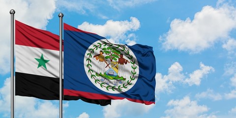 Syria and Belize flag waving in the wind against white cloudy blue sky together. Diplomacy concept,...