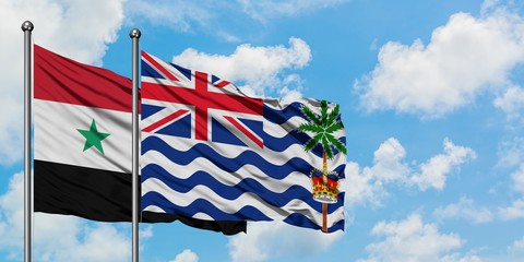 Syria and British Indian Ocean Territory flag waving in the wind against white cloudy blue sky together. Diplomacy concept, international relations.