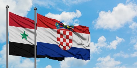 Syria and Croatia flag waving in the wind against white cloudy blue sky together. Diplomacy...