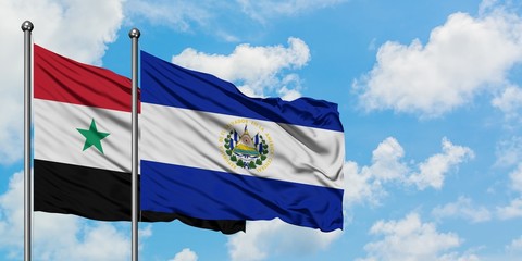 Syria and El Salvador flag waving in the wind against white cloudy blue sky together. Diplomacy concept, international relations.