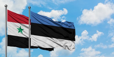 Syria and Estonia flag waving in the wind against white cloudy blue sky together. Diplomacy...