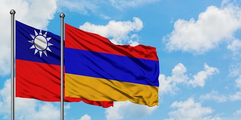 Taiwan and Armenia flag waving in the wind against white cloudy blue sky together. Diplomacy concept, international relations.