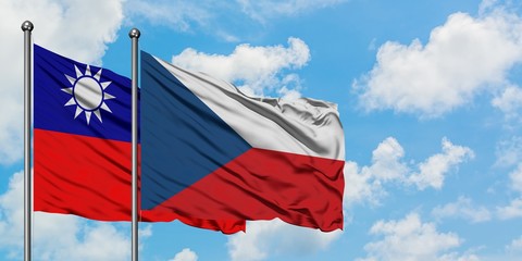 Taiwan and Czech Republic flag waving in the wind against white cloudy blue sky together. Diplomacy concept, international relations.
