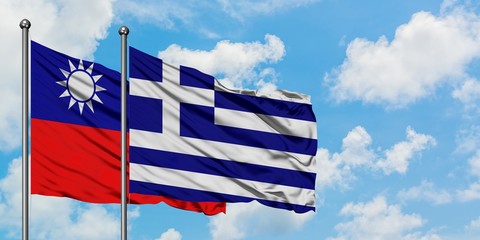 Taiwan and Greece flag waving in the wind against white cloudy blue sky together. Diplomacy concept, international relations.