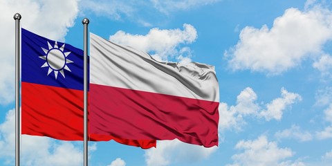 Taiwan and Poland flag waving in the wind against white cloudy blue sky together. Diplomacy concept, international relations.