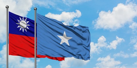 Taiwan and Somalia flag waving in the wind against white cloudy blue sky together. Diplomacy concept, international relations.