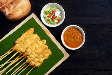 Pork satay - Grilled pork served with peanut sauce or sweet and sour sauce on Banana leaf with...