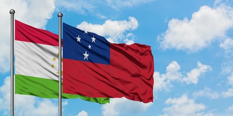 Tajikistan and Samoa flag waving in the wind against white cloudy blue sky together. Diplomacy...