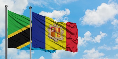 Tanzania and Andorra flag waving in the wind against white cloudy blue sky together. Diplomacy concept, international relations.