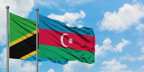 Tanzania and Azerbaijan flag waving in the wind against white cloudy blue sky together. Diplomacy concept, international relations.