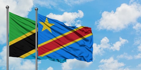 Tanzania and Congo flag waving in the wind against white cloudy blue sky together. Diplomacy concept, international relations.