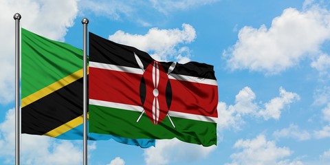 Tanzania and Kenya flag waving in the wind against white cloudy blue sky together. Diplomacy...