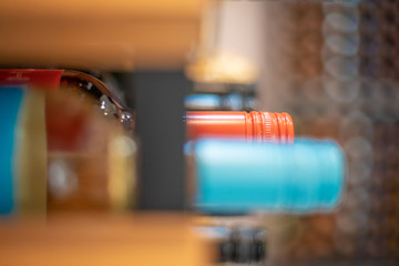 wine bottles in a large rack in a wine cellar