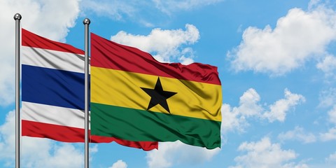 Thailand and Ghana flag waving in the wind against white cloudy blue sky together. Diplomacy concept, international relations.