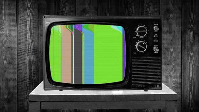 vintage television with distort vertical colorful lines, damaged VHS videotape