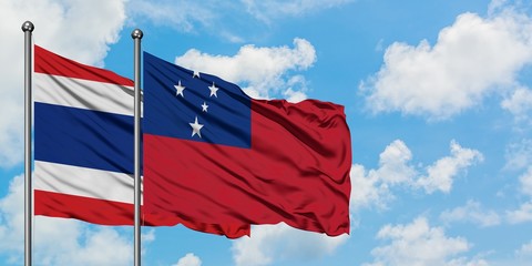 Thailand and Samoa flag waving in the wind against white cloudy blue sky together. Diplomacy concept, international relations.