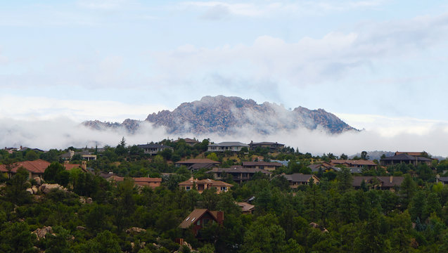 Granite Mountain clothed in clouds as morning comes to Northern Arizona