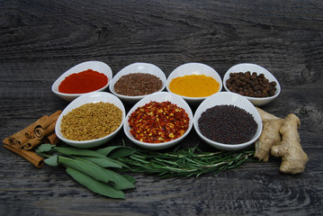 Herbs and spices on a rustic background