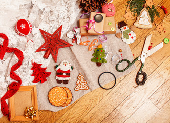 lot of stuff for handmade gifts, scissors, ribbon, paper with countryside pattern, ready for holiday concept, nobody home