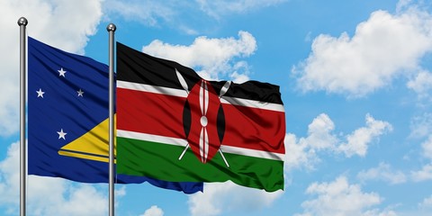 Tokelau and Kenya flag waving in the wind against white cloudy blue sky together. Diplomacy concept, international relations.