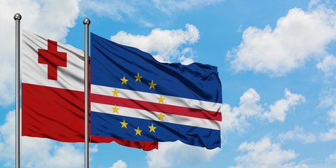Tonga and Cape Verde flag waving in the wind against white cloudy blue sky together. Diplomacy concept, international relations.