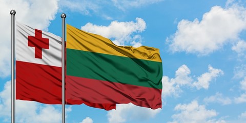 Tonga and Lithuania flag waving in the wind against white cloudy blue sky together. Diplomacy concept, international relations.