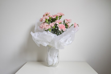 Carnations flower in the glass vase.