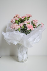 Obraz na płótnie Canvas Carnations flower in the glass vase.