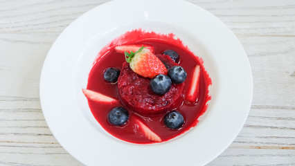 Summer pudding with berries and sauce