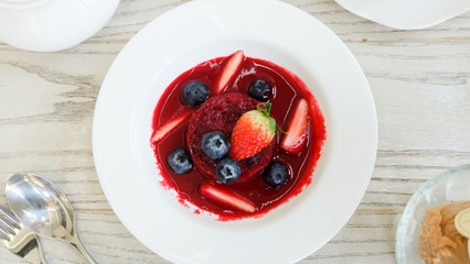 Summer pudding with berries and sauce
