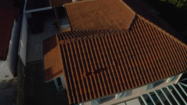 Aerial Drone Shot over isolated french house with orange tiled roof in Basque country, France. French city in 4K UHD, the day. Tracking in.
