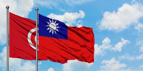Tunisia and Taiwan flag waving in the wind against white cloudy blue sky together. Diplomacy concept, international relations.