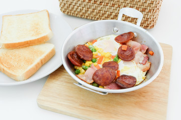 Breakfast with fried eggs in pan