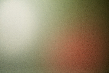 Against a darkly textured background, volumetric spots of white and red light