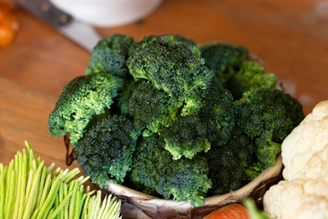 bowl of cooked fresh green broccoli - fresh and organic vegetables