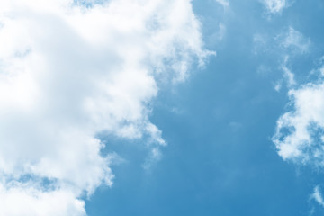 White cloud and blue sky background with copy space