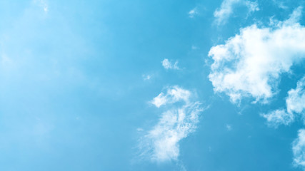 White cloud and blue sky background with copy space