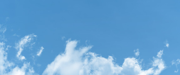 white cloud and blue sky background with copy space