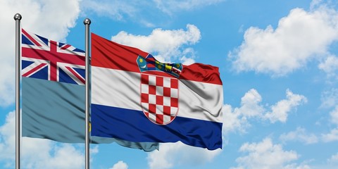 Tuvalu and Croatia flag waving in the wind against white cloudy blue sky together. Diplomacy concept, international relations.
