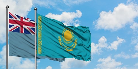 Tuvalu and Kazakhstan flag waving in the wind against white cloudy blue sky together. Diplomacy concept, international relations.