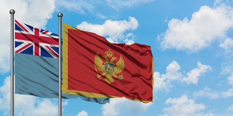 Tuvalu and Montenegro flag waving in the wind against white cloudy blue sky together. Diplomacy concept, international relations.