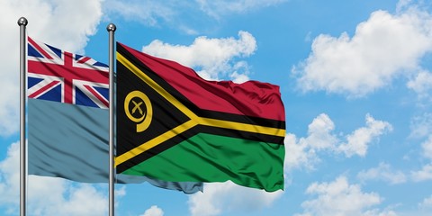 Tuvalu and Vanuatu flag waving in the wind against white cloudy blue sky together. Diplomacy concept, international relations.