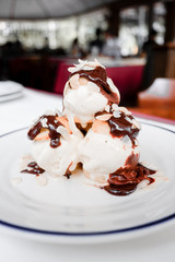 Choux pastry with vanilla ice cream and hot chocolate sauce