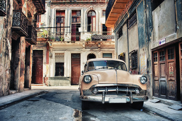 Old classic car in a street of havana with buildings in background - 301300389