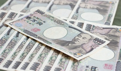 Fototapeta premium japanese banknotes, Money is essential in forex trading. Concept Travel saving