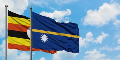 Uganda and Nauru flag waving in the wind against white cloudy blue sky together. Diplomacy concept, international relations.