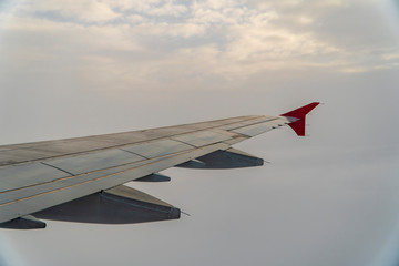 Fototapeta na wymiar Airplane wing in midflight