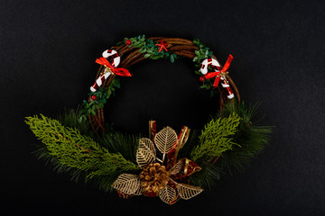 Christmas composition. Girlanda decorated on black background. Christmas, winter, new year concept. Flat lay, top view, copy space. © Julio Ricco
